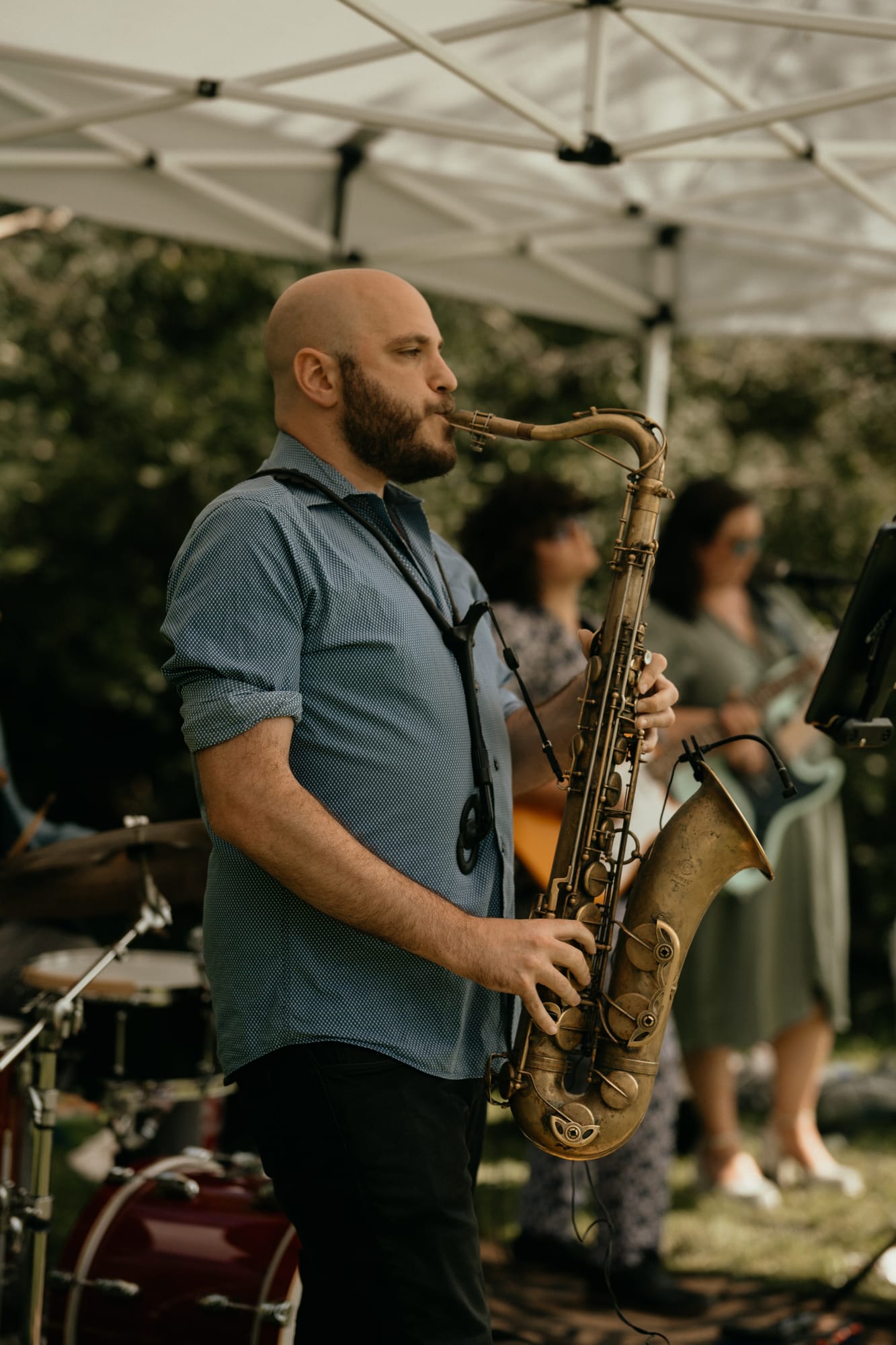 Saxophonist playing during a wedding cocktail hour