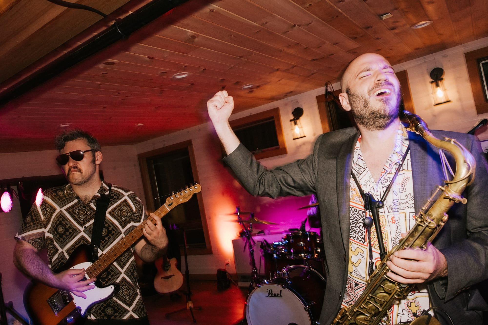 Saxophone player performing over the DJ mix at a wedding reception