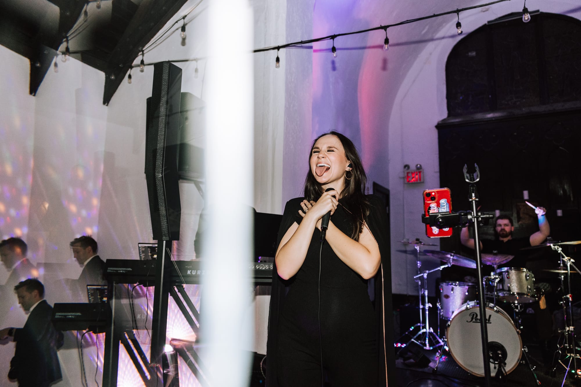 The Z Keys vocalist performing at an evening event