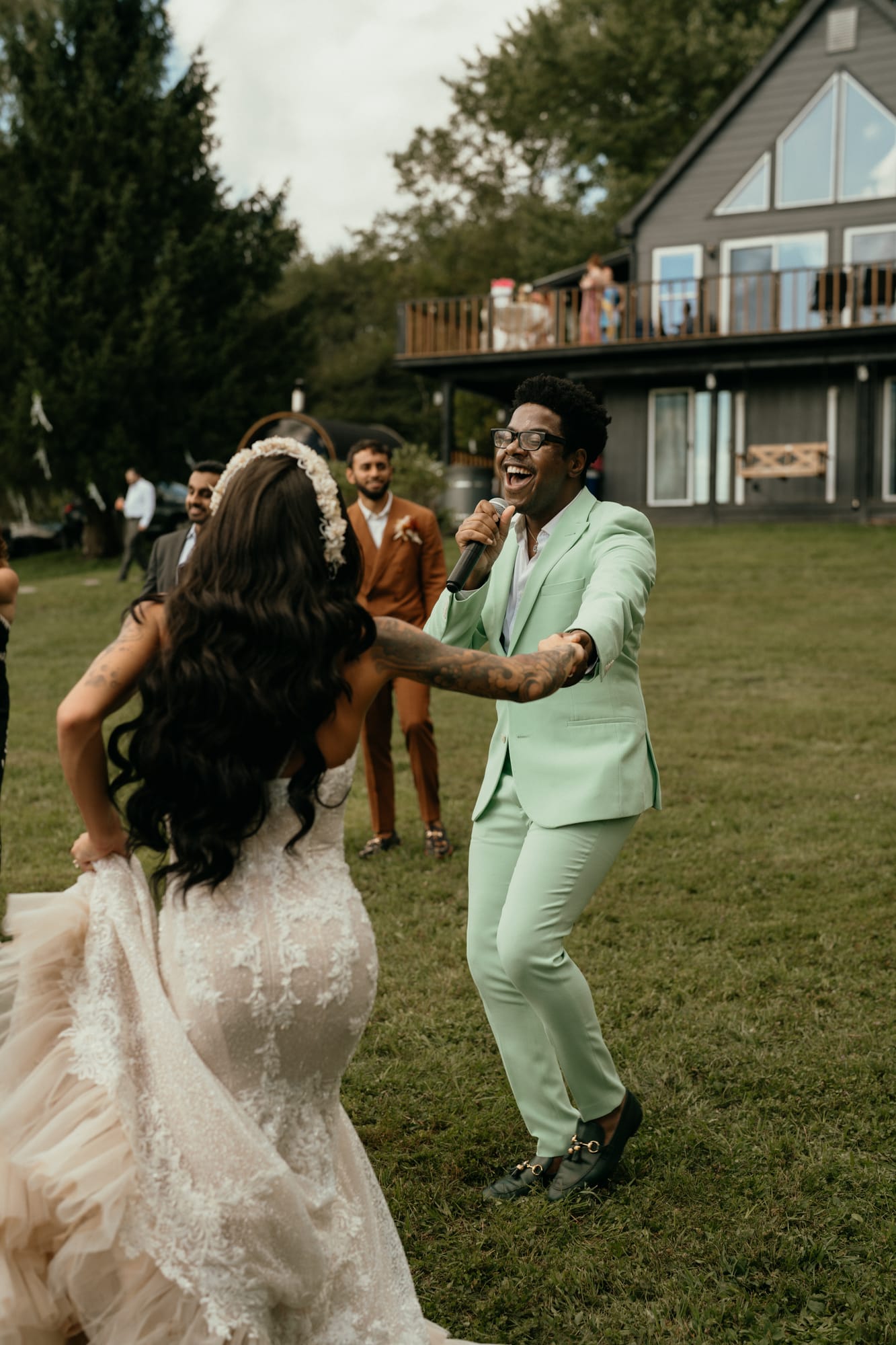 Live vocalist dancing with the bride during a wedding performance