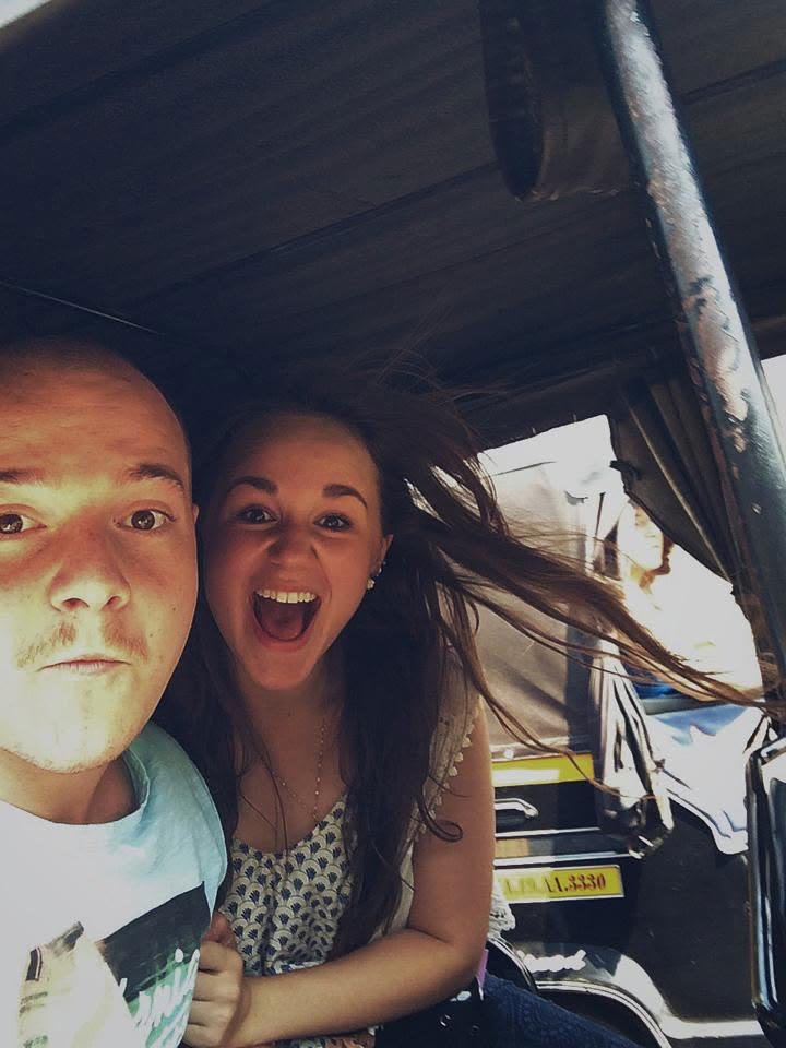 Tino and Emily in a tuk-tuk while touring overseas